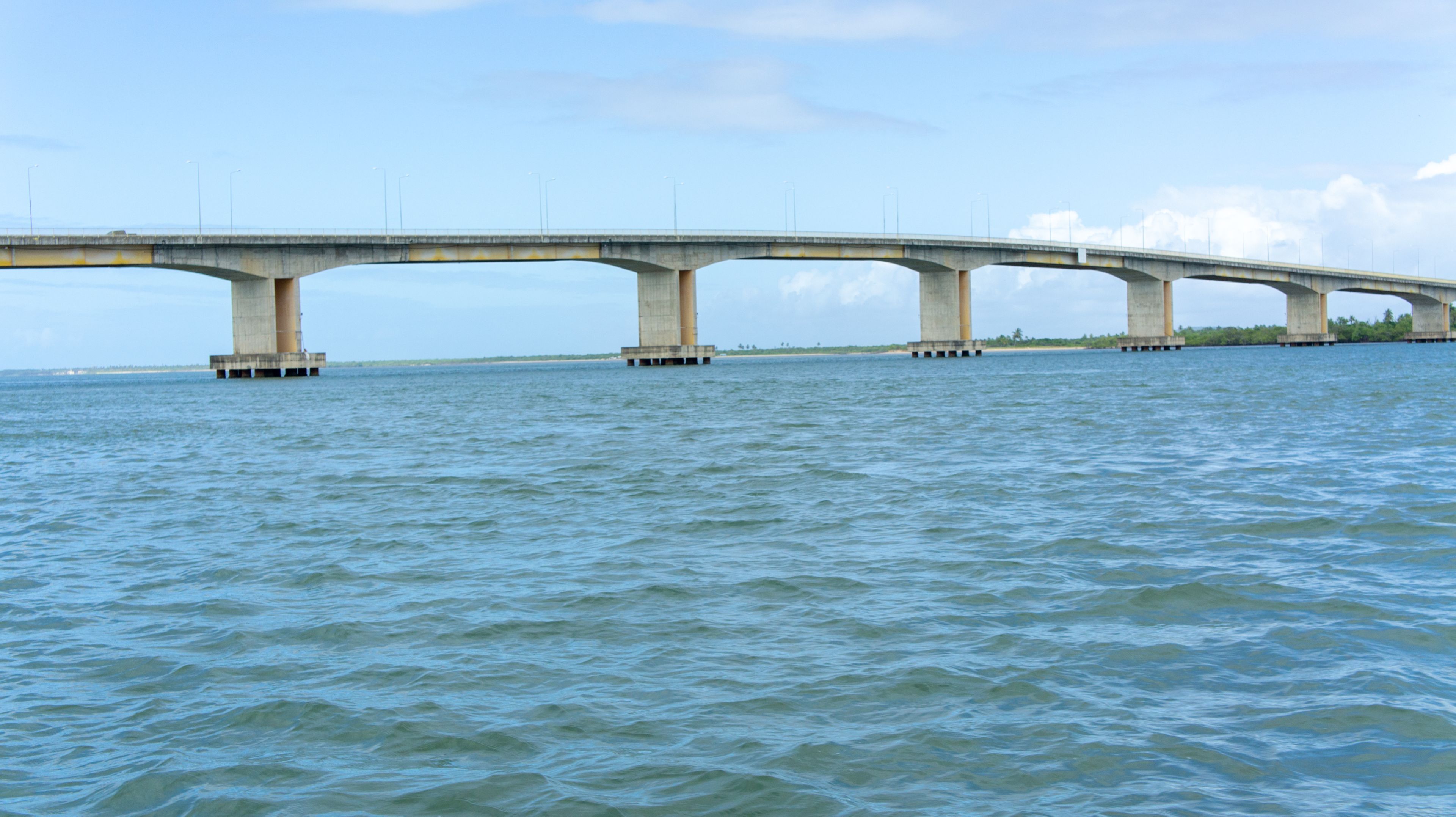 A large bridge spanning a body of water with multiple supports.