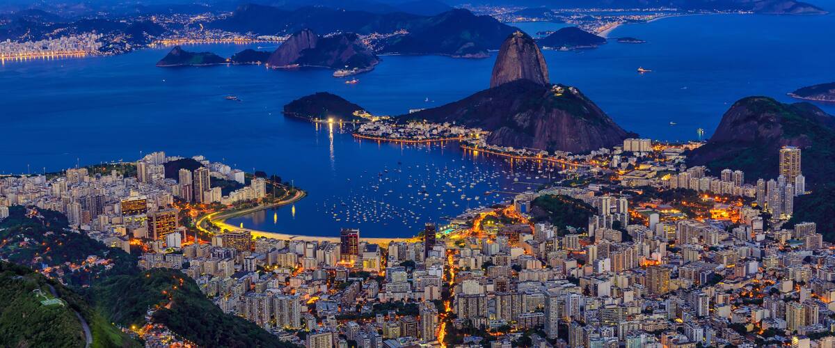 Night view of mountain Sugar Loaf and Botafogo in Rio de Janeiro. Brazil