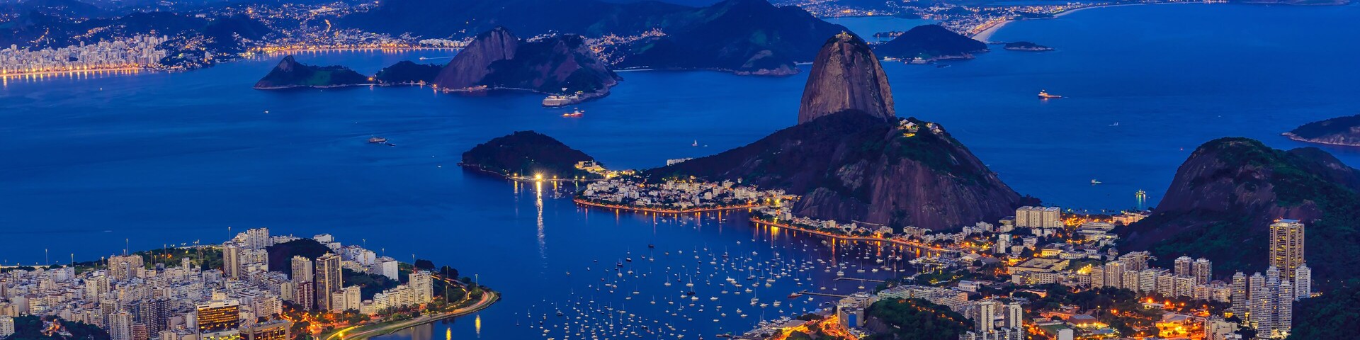 Night view of mountain Sugar Loaf and Botafogo in Rio de Janeiro. Brazil