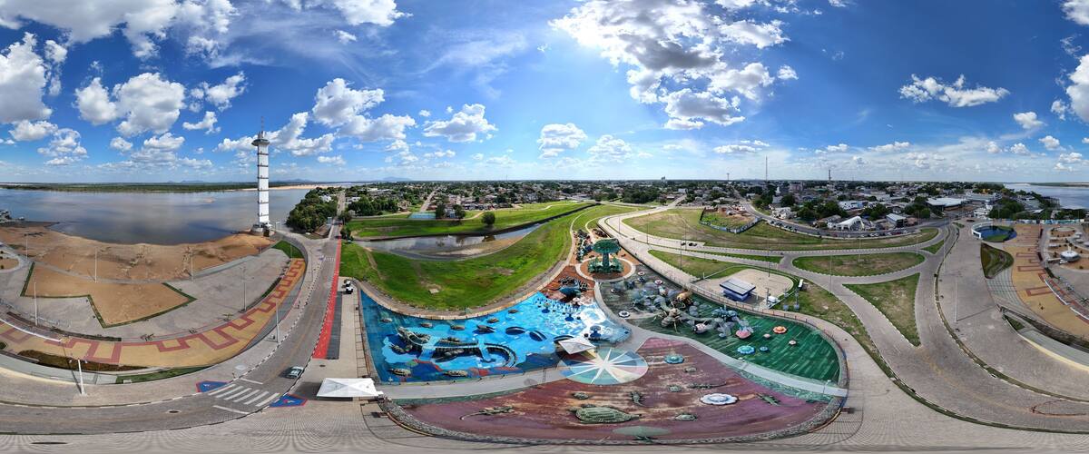 A large water park with a winding road and a lighthouse.