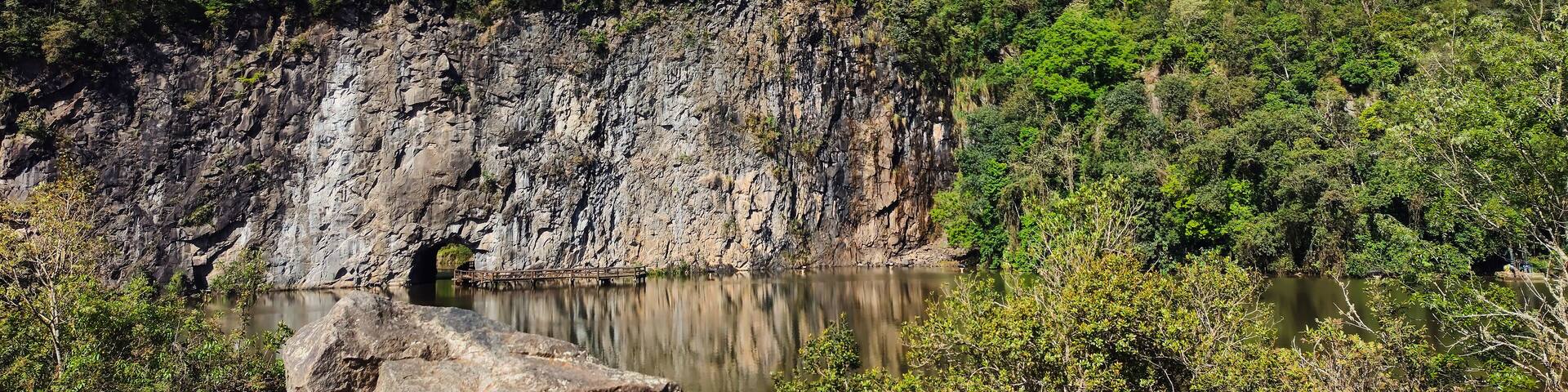 Beautiful panoramic view of Parque Tanguá with green trees, lake and rocky mountain, Curitiba, Paraná, Brazil