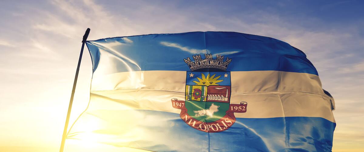 Nilopolis of Brazil flag waving on the top sunrise mist fog