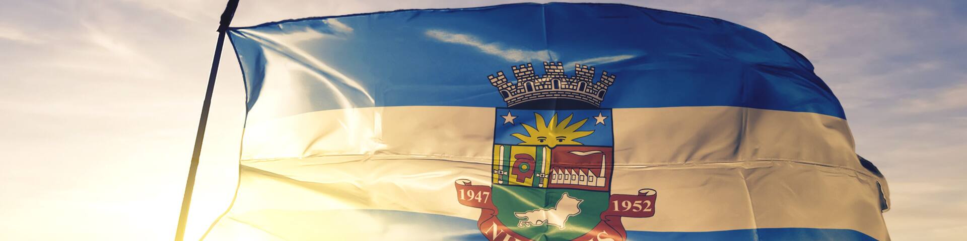 Nilopolis of Brazil flag waving on the top sunrise mist fog