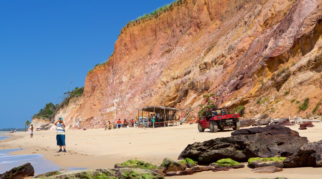 Maceio featuring rugged coastline, a sandy beach and general coastal views