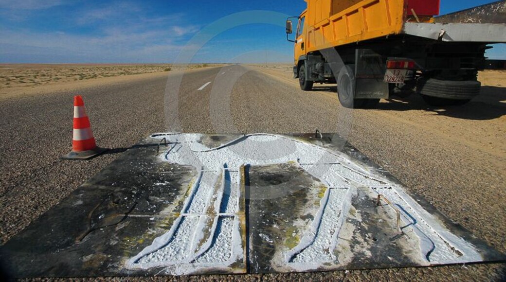 Camel crossing road sign in the middle of nowhere