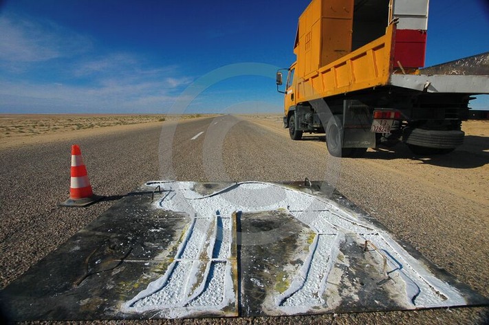 Camel crossing road sign in the middle of nowhere