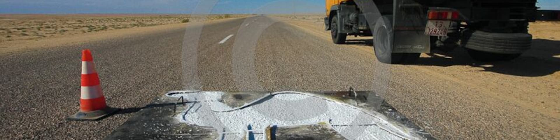 Camel crossing road sign in the middle of nowhere