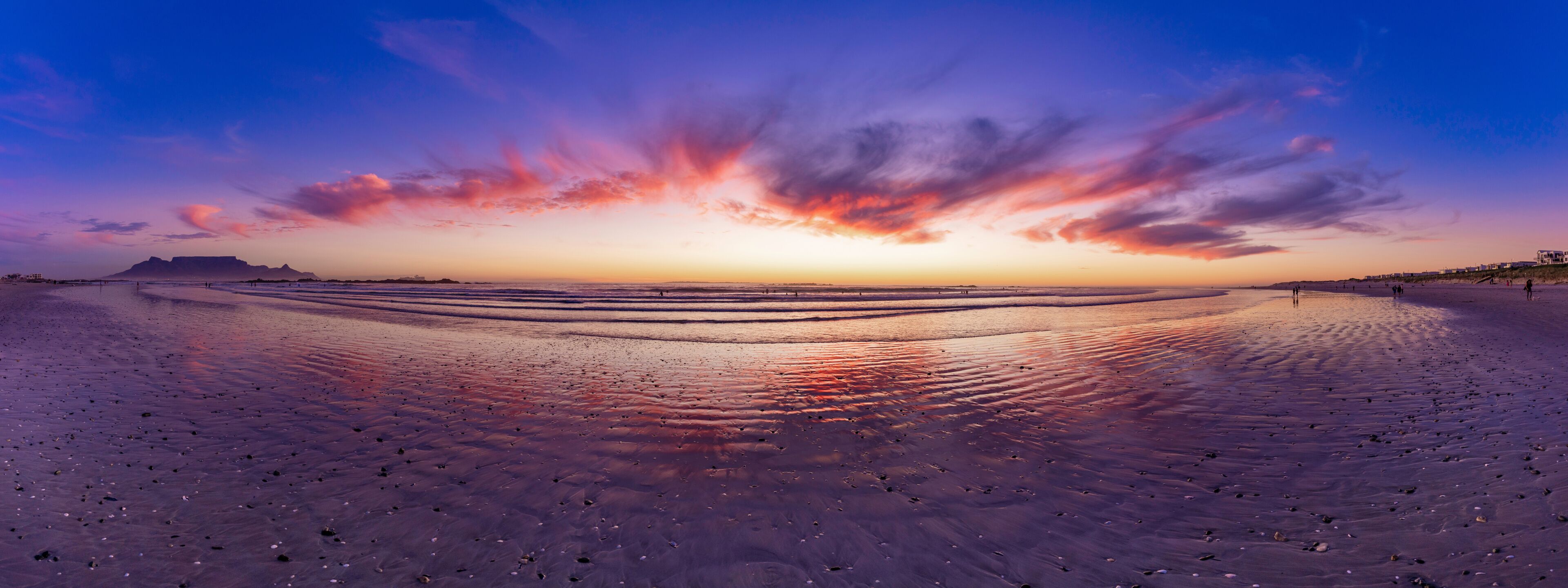 Glorious African sunset Panorama of Big Bay beach and Table mountain a stunning vision in Cape Town, South Africa