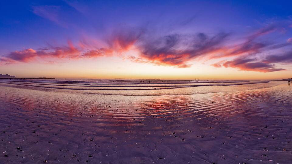 Glorious African sunset Panorama of Big Bay beach and Table mountain a stunning vision in Cape Town, South Africa