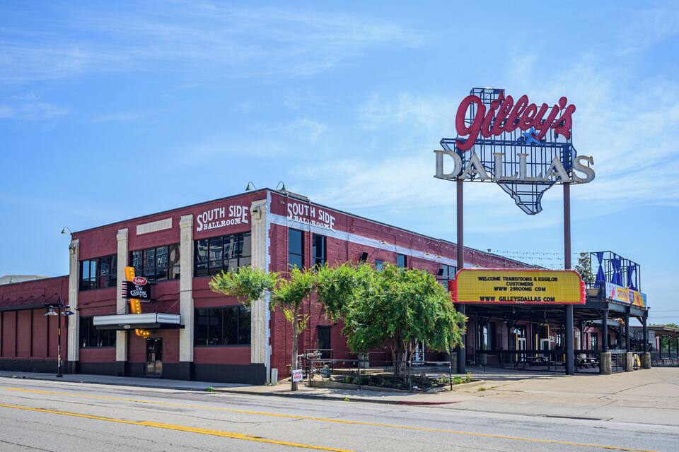 A building with a large sign reading "Gilley's Dallas" and "South Side Bar Room."