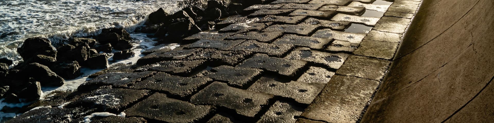 Evening sun illuminates the Seawall at Galveston, Texas