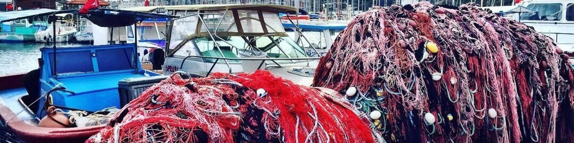 A marina with boats and fishing nets.