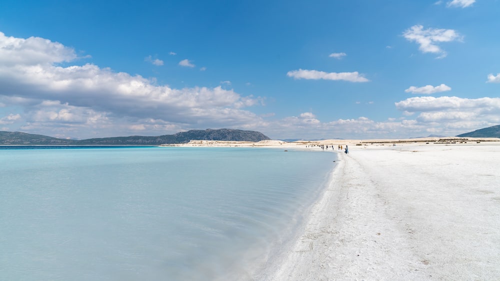 Tourists walking in the beach of Salda Lake, Burdur, Turkey