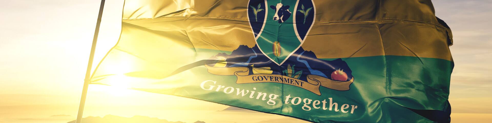 Murang'a county of Kenya flag waving on the top sunrise mist fog