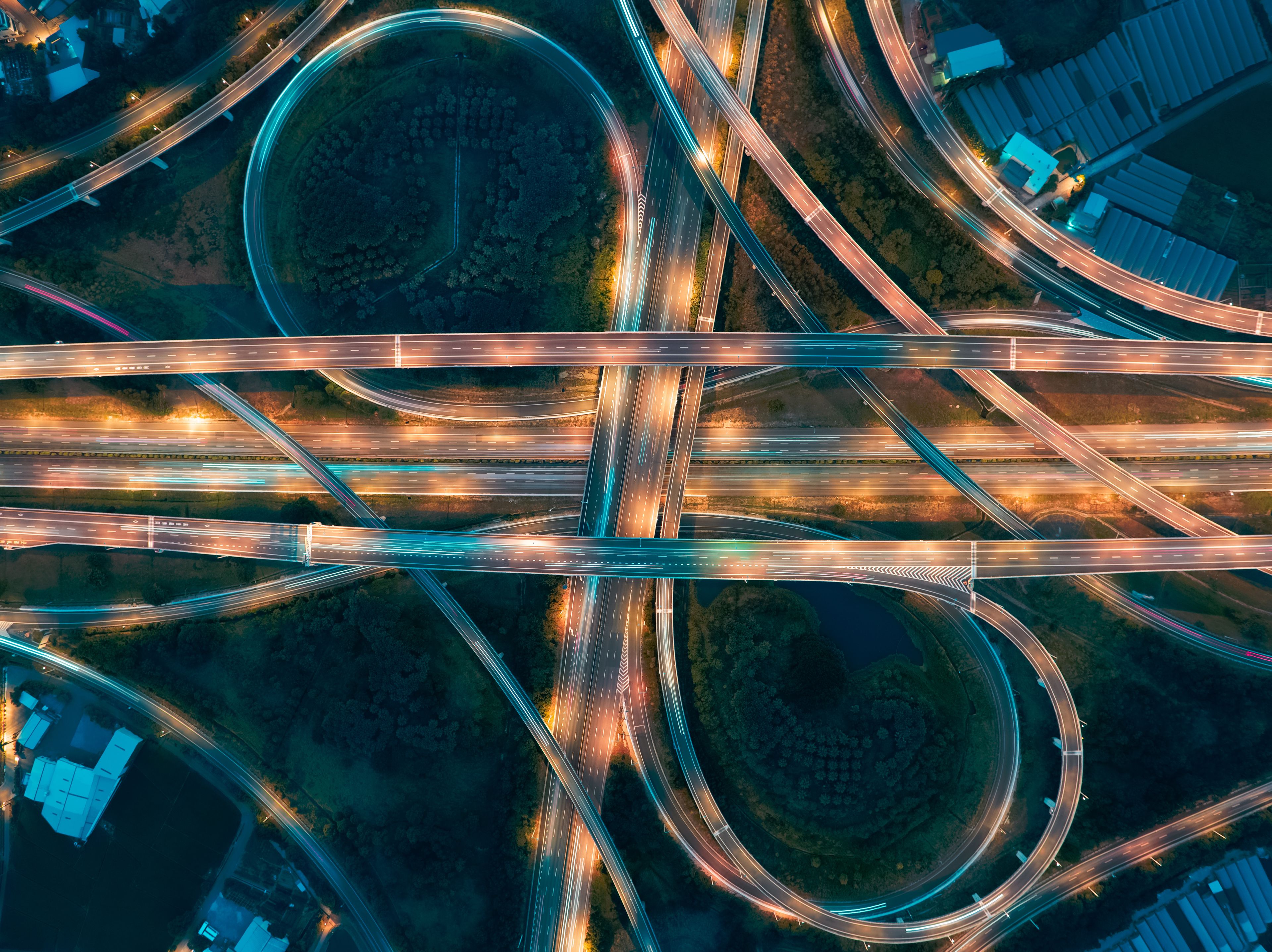 An aerial view of a complex highway interchange with multiple overpasses and underpasses.