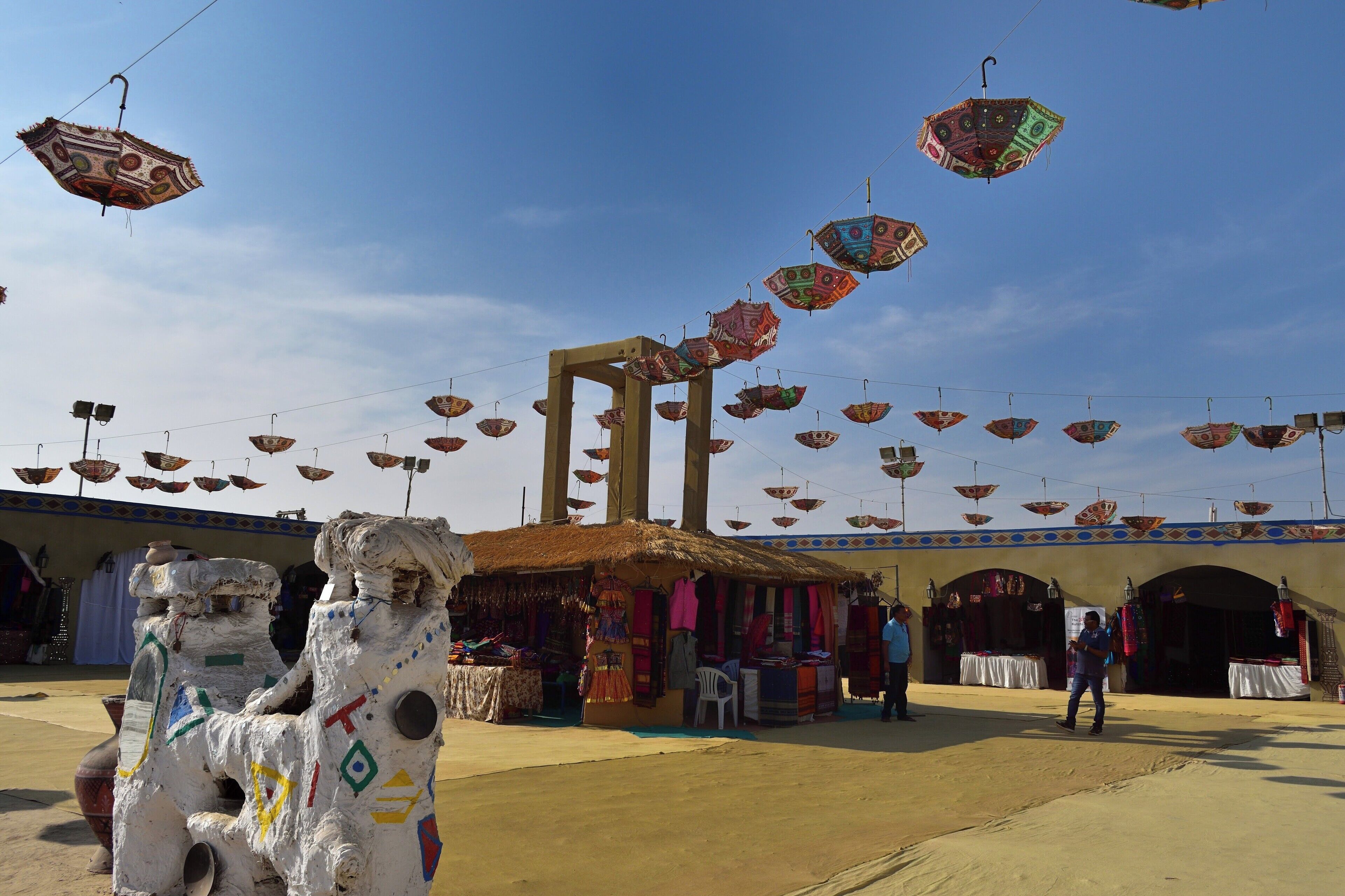 The shopping arcade at the tent city adorned by a canopy of colourful umbrellas