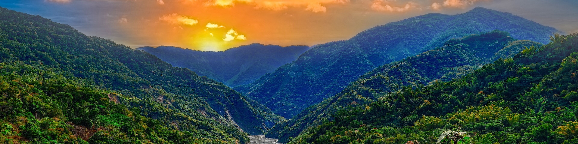 Rolling mountain,sunrise sky and winding valley grass view form a vast scenic scene. High quality photo photography in Baolai, Kaohsiung City, Taiwan.Use in branding, screensavers, websites, etc.