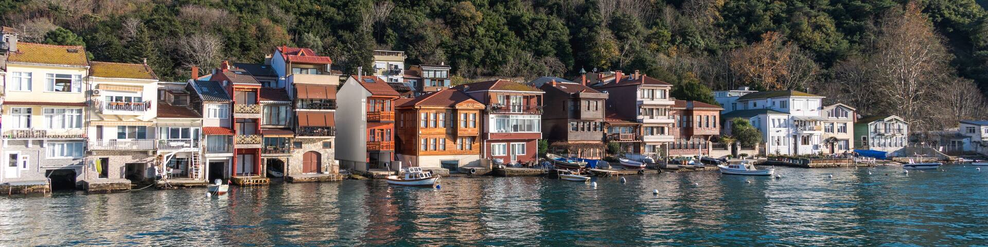 View of waterfront houses small fishing town in Asian side of the city. Anadolu Kavağı, Istanbul, Turkey.