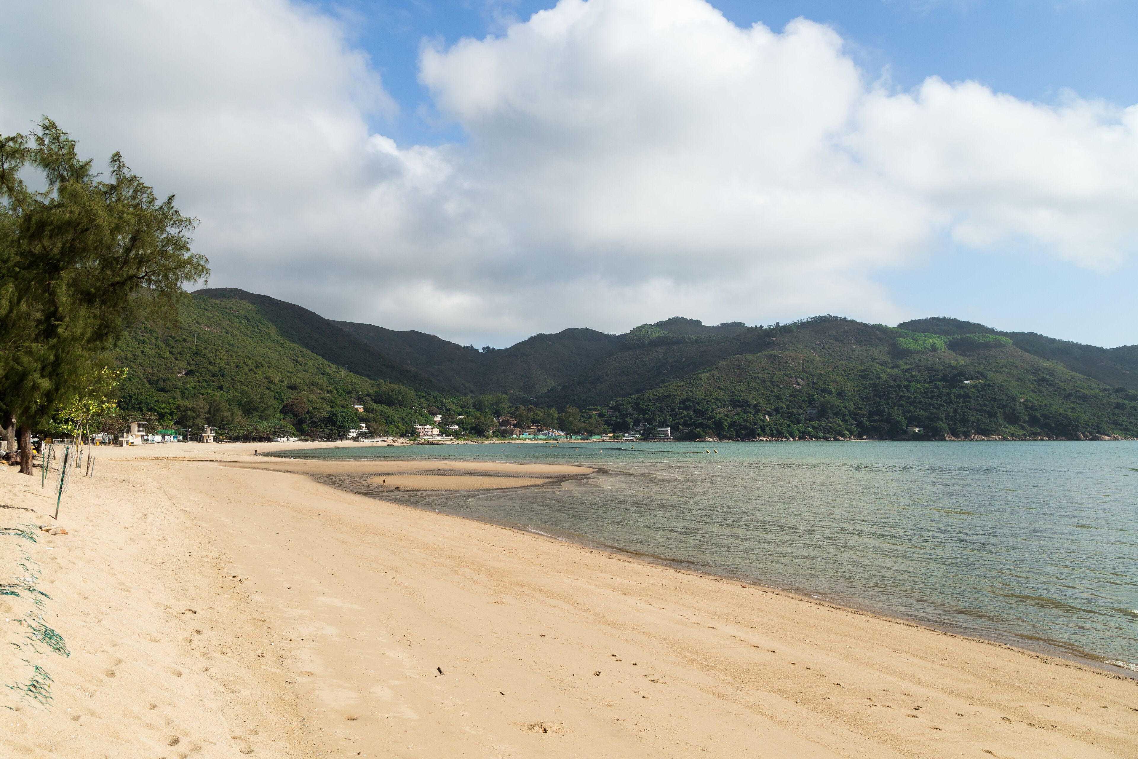 Quiet Silvermine Bay Beach in Mui Wo town on Lantau Island in Hong Kong, China.