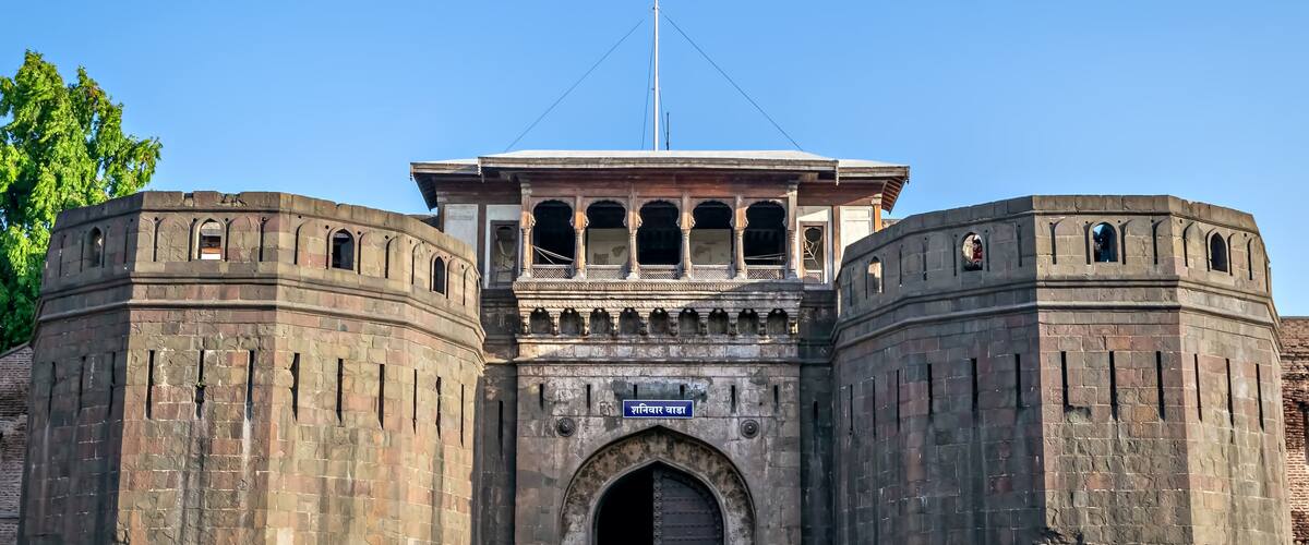 Historical , ancient, stone made monument named Shaniwar Wada in Pune. Text in local language is name" Shaniwar Wada".