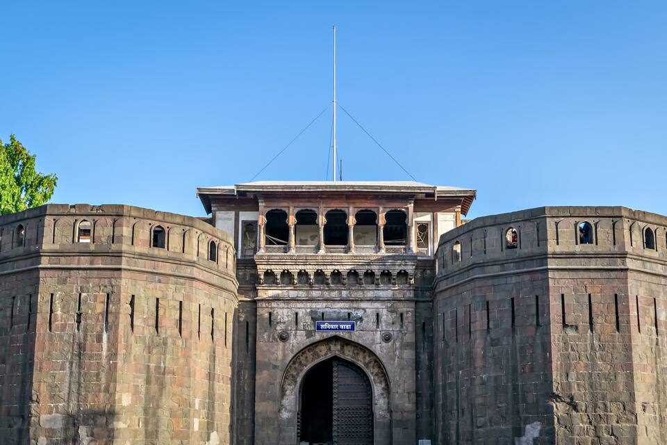 Historical , ancient, stone made monument named Shaniwar Wada in Pune. Text in local language is name" Shaniwar Wada".