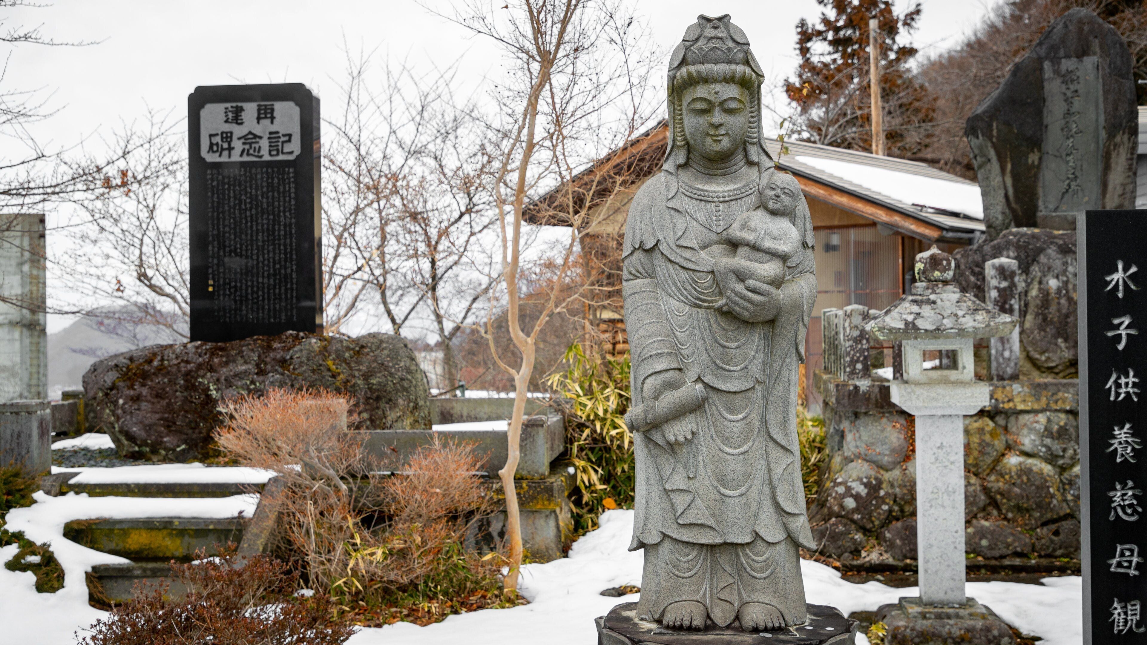 Heiwakannon showing heritage elements, a statue or sculpture and snow
