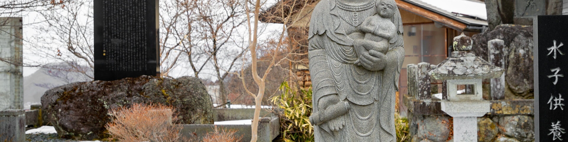 Heiwakannon showing heritage elements, a statue or sculpture and snow