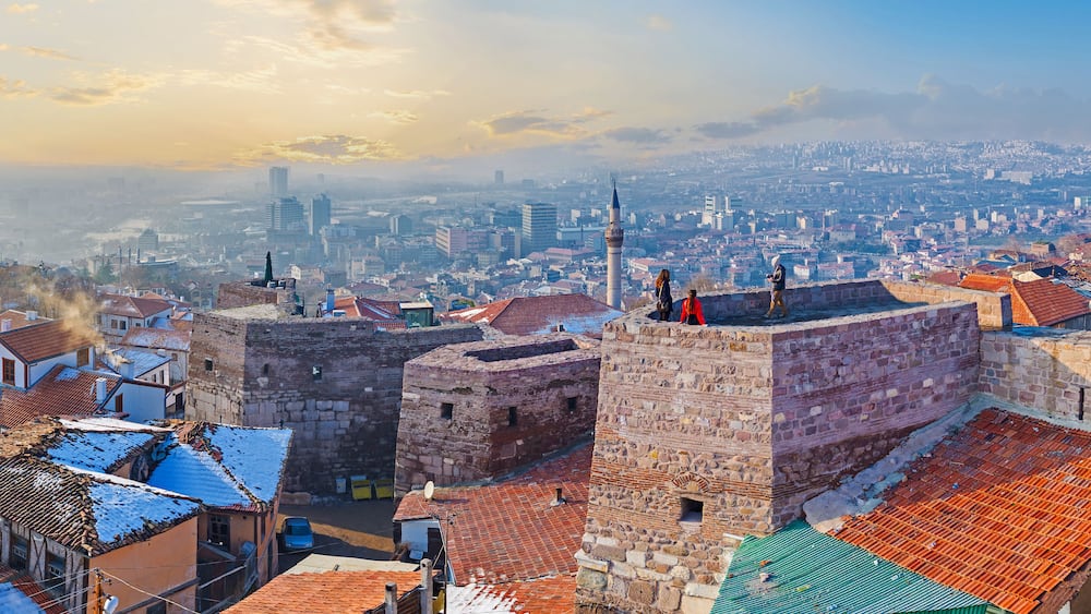 The sunset cityscape with the old rampart of Ankara Castle, Turkey