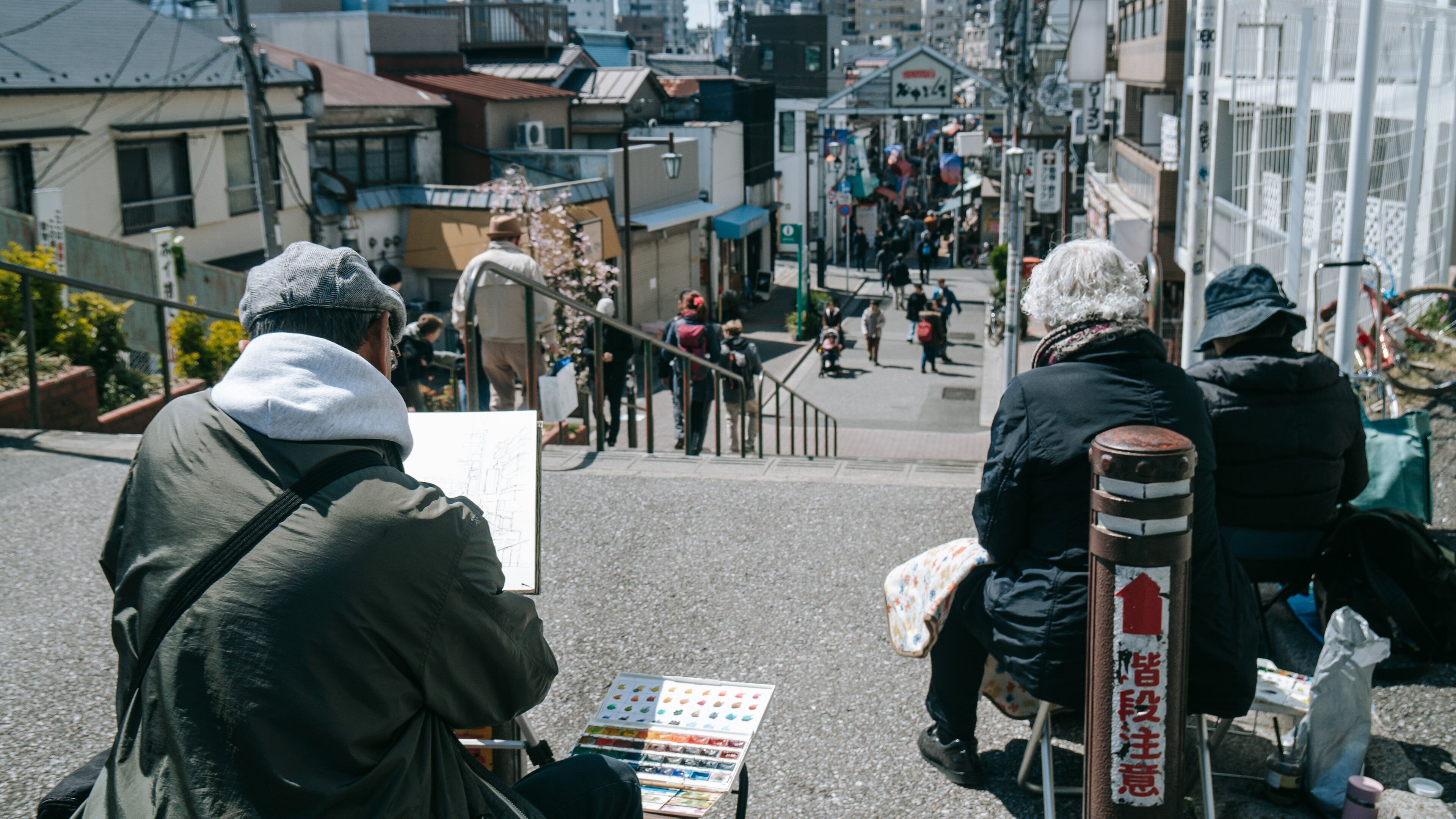 Yanaka showing street scenes as well as a small group of people