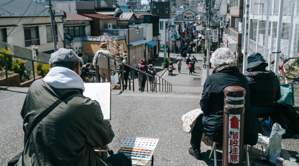 Yanaka showing street scenes as well as a small group of people