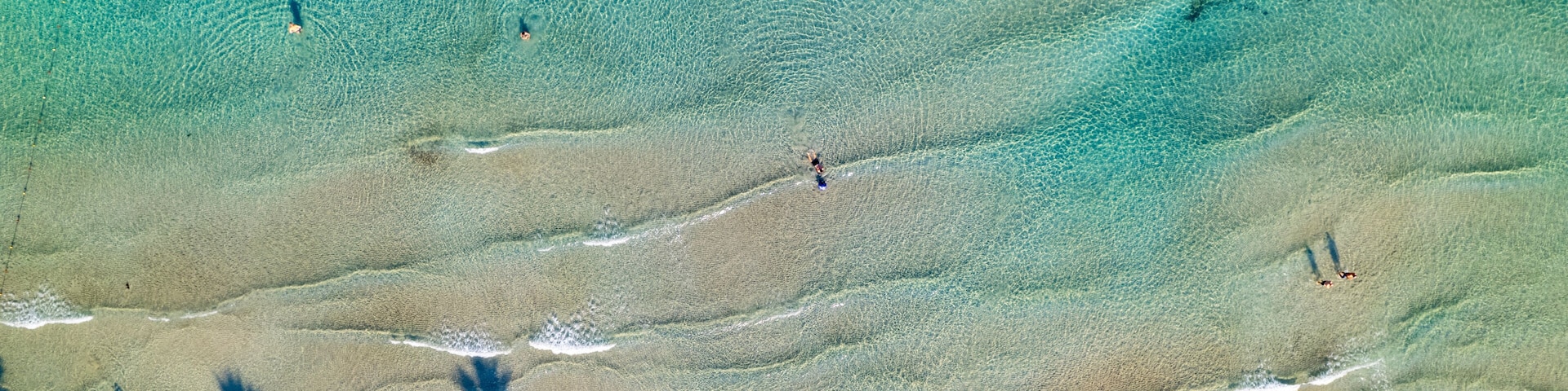Kusadasi, Aydin, Turkey. Ladies Beach (Turkish: Kadinlar Denizi) in Kusadasi. Touristic beach resort town on Turkey. Aerial view of Kusadasi.