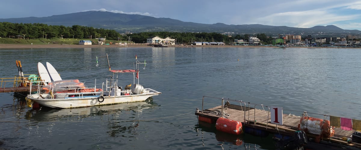 moored boat and pier near Iho Tewoo Beach on Jeju island