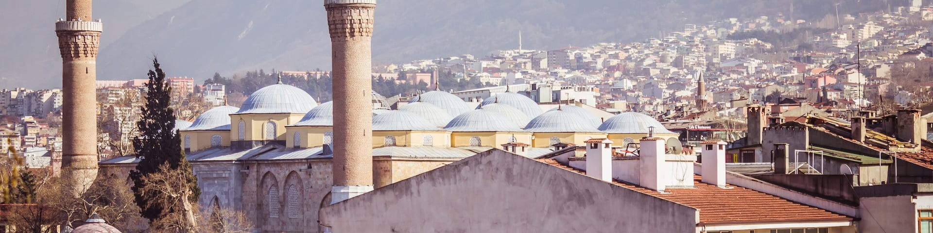 Bursa Grand Mosque and Uludag mountain landscape view.