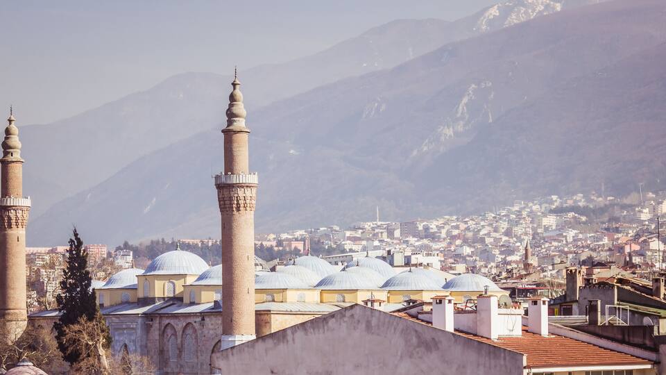 Bursa Grand Mosque and Uludag mountain landscape view.