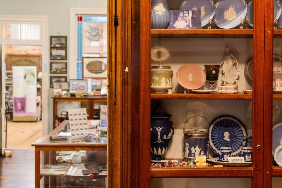 A display of vintage china and porcelain in a shop.