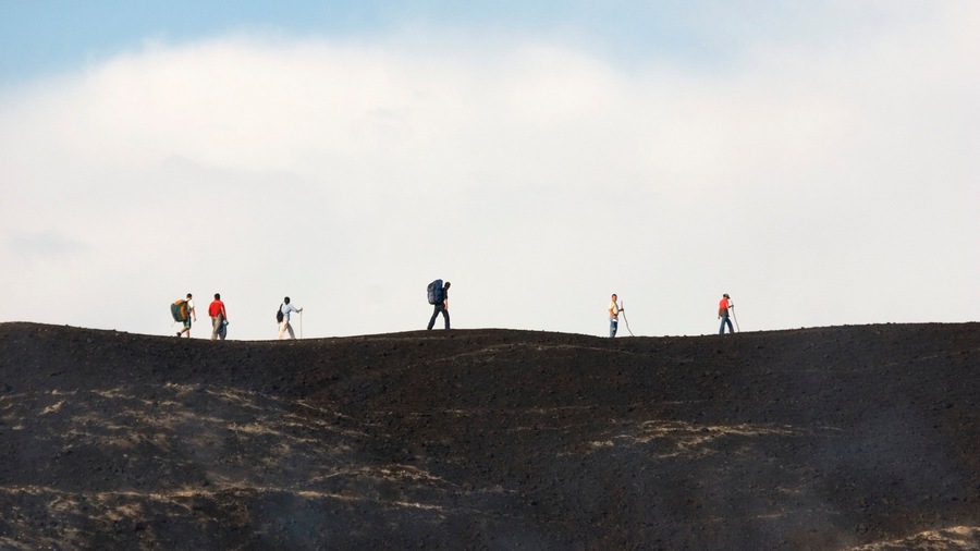 Nicaragua which includes hiking or walking and mountains as well as a large group of people