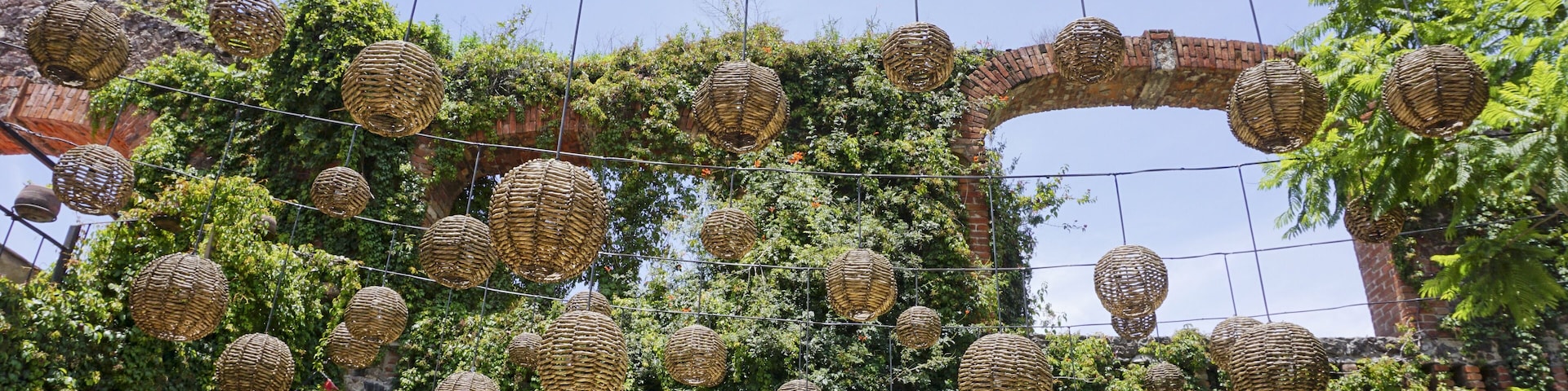 Park decorated with decorative straw balls in Val'Quirico, Mexico