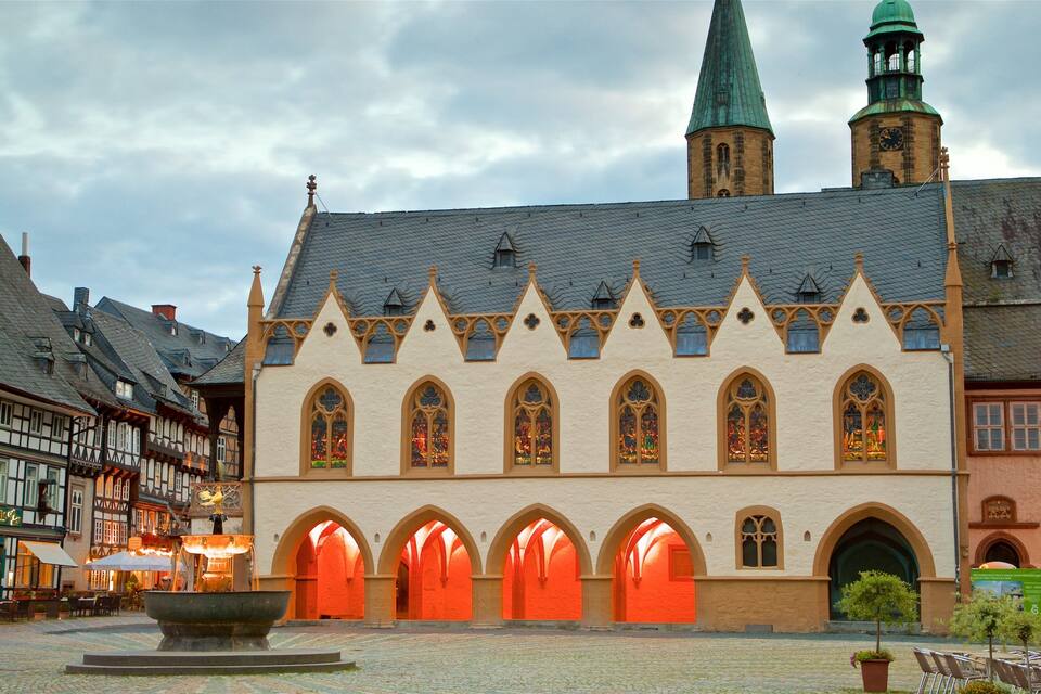 A historic building with pointed arches and a clock tower.