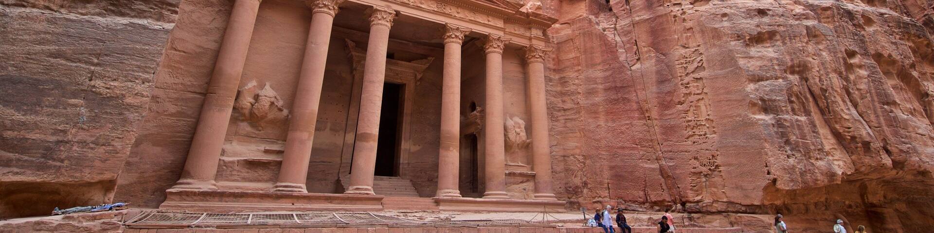 Wadi Musa featuring heritage architecture and a gorge or canyon as well as a small group of people