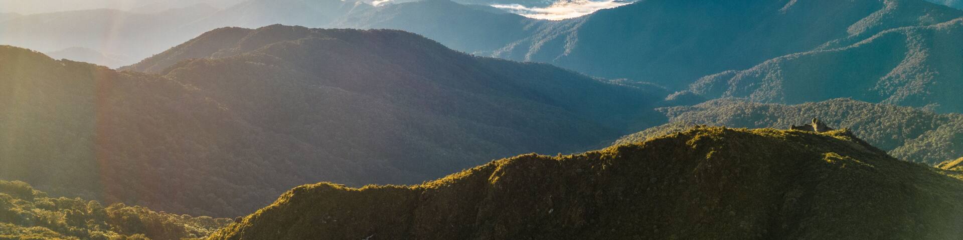 Aerial shot of a landscape full of mountains and a sunrise at Chirripo National Park in Costa Rica