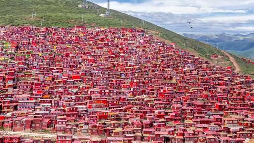 #LifeAtExpedia
Larong Wuming Buddhist Institute in Sertar, Sichuan; perched on a hillside of 4000 metres above sea level, thousands of RED cabins are the homes of Buddhist monks and nuns.