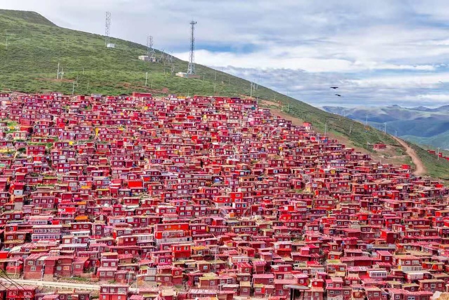 #LifeAtExpedia
Larong Wuming Buddhist Institute in Sertar, Sichuan; perched on a hillside of 4000 metres above sea level, thousands of RED cabins are the homes of Buddhist monks and nuns.