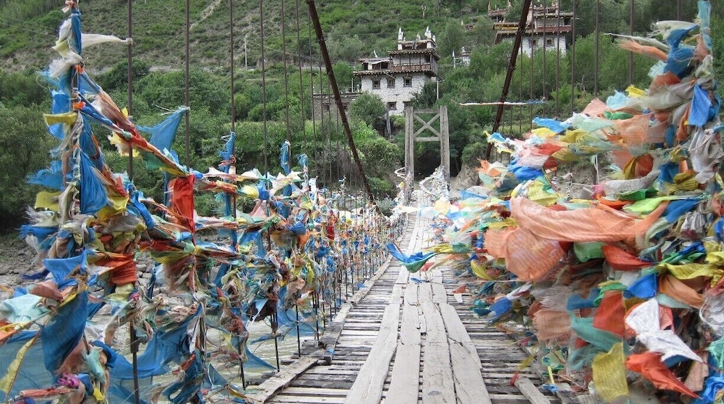 #TroveOn - Unless you have your own transportation, the only way to reach this far-flung town is by bus and itâs a twelve hour ride (donât believe it if they tell you 9-10!) Danba lies in a valley near the east border of Ganzi province in southwestern China. Snow-capped mountains tower in the distance over the lower grasslands and valleys. The area is known as the âKingdom of Watchtowersâ and also as âBeauty Valleyâ for both its landscapes and its pretty ladies! More details: http://turtlestravel.com/dont-skip-danba-china/