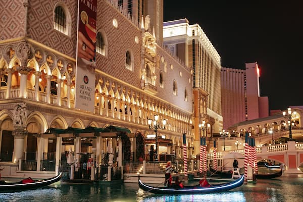 The Venetian Casino showing night scenes, kayaking or canoeing and a city