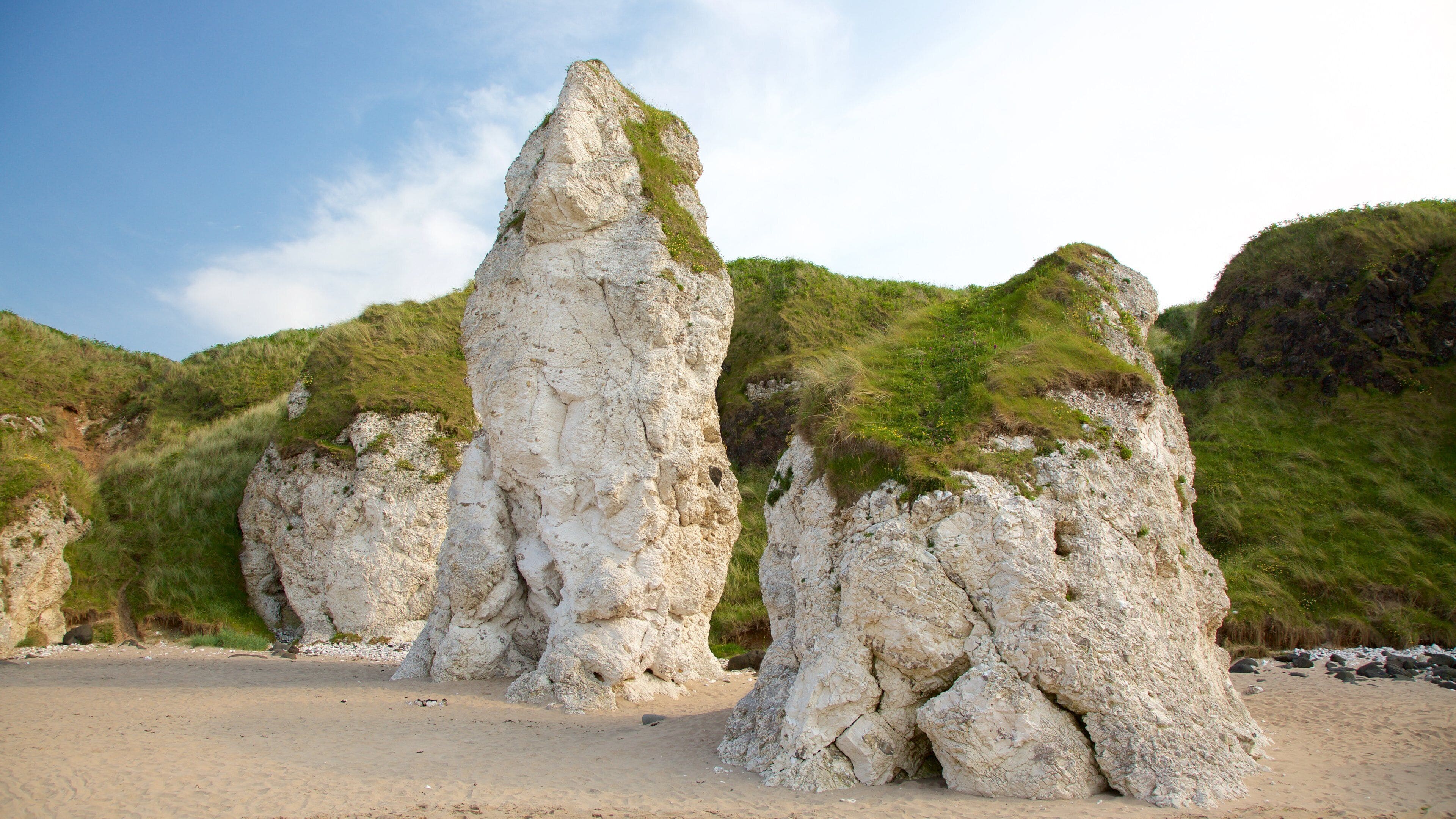 Portrush featuring a sandy beach and general coastal views