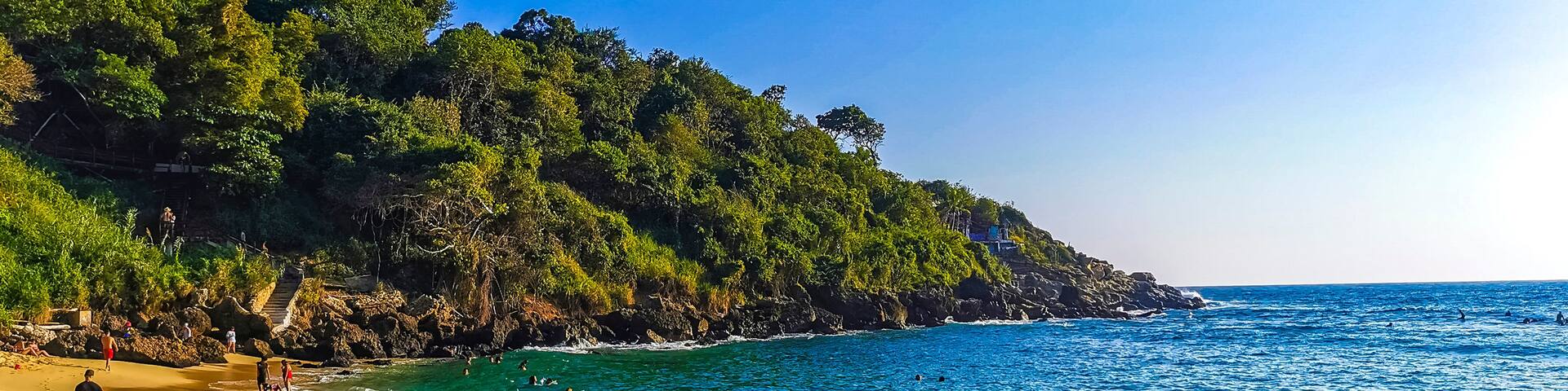 Beach sand blue water huge surfer waves Carrizalillo Puerto Escondido.