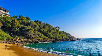 Beach sand blue water huge surfer waves Carrizalillo Puerto Escondido.