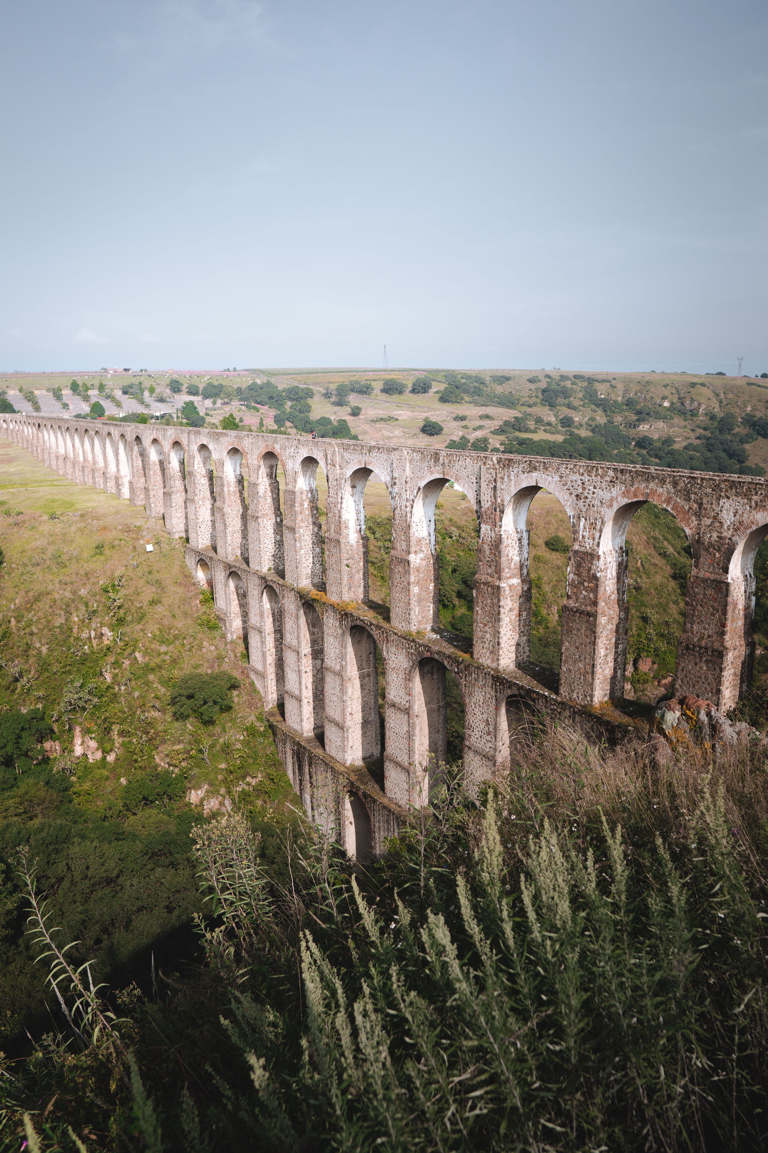A long viaduct with multiple arches spanning a valley.