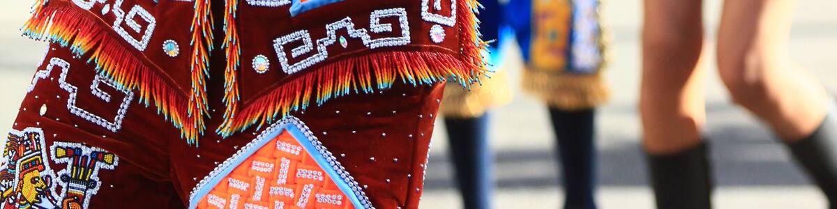 A Male dancer from Yauhquemehcan with colorful costume made with sequins and crest with colorful plumes