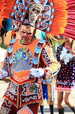 A Male dancer from Yauhquemehcan with colorful costume made with sequins and crest with colorful plumes